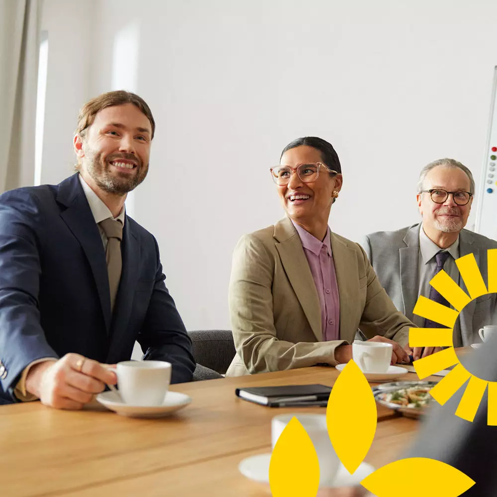 Cheerful people are discussing in the meeting room