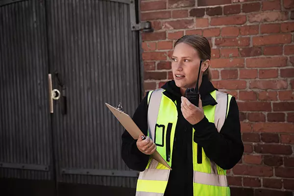 A woman wearing a safety vest