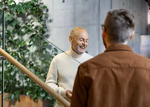 Two men are talking at the office