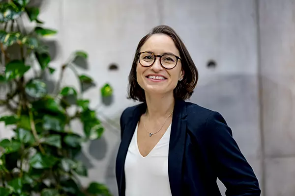 A woman smiles in the office