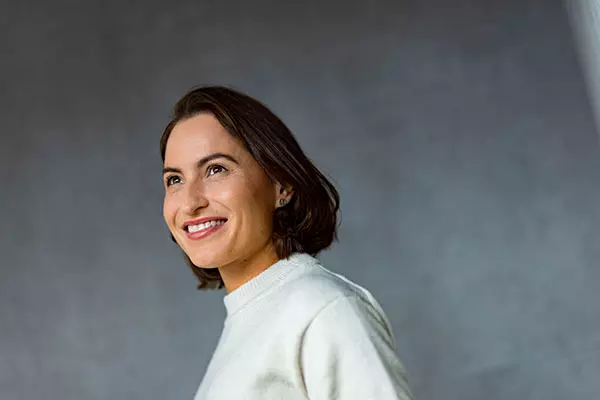 A woman smiles